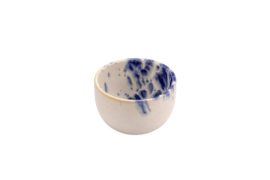 White bowl with blue reactive dots